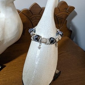 Faux Pandora like bracelet with travel themed charms.